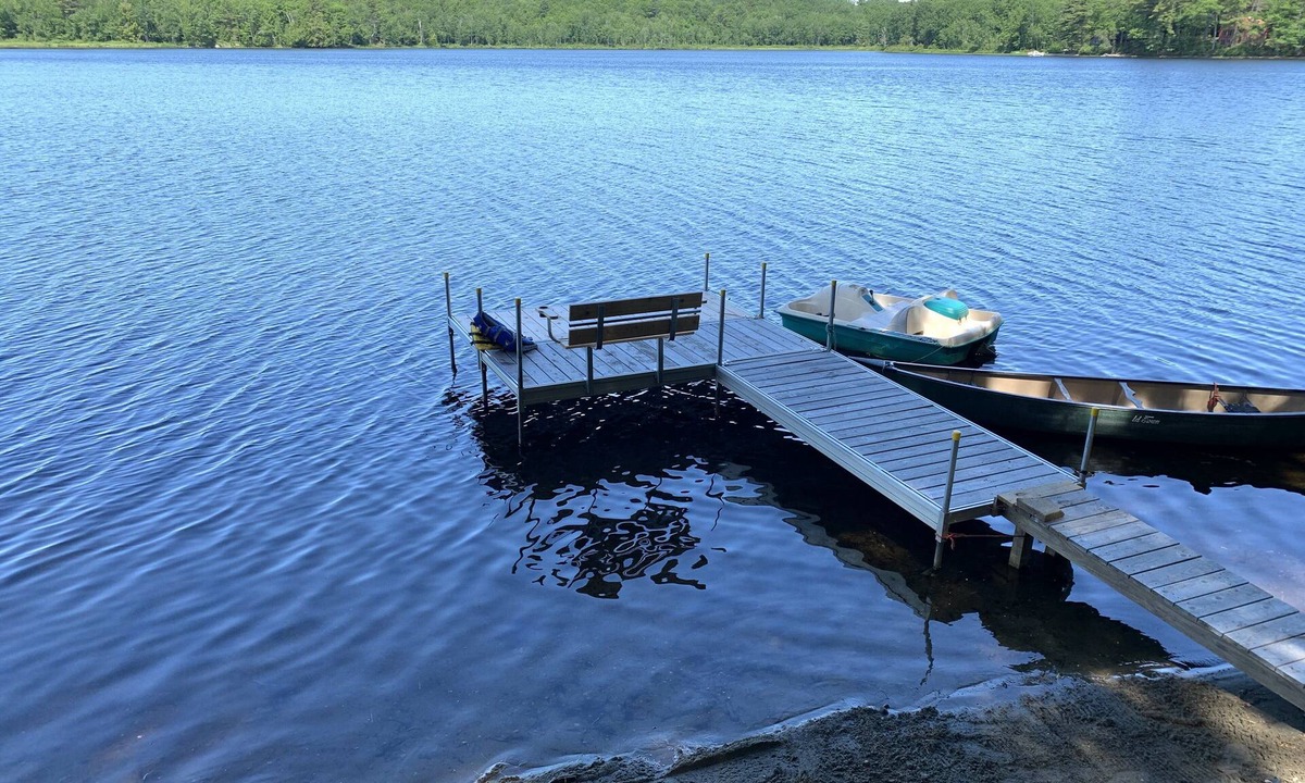 North Jay Cottage | Lake House with Swim Area, Dock, Deck, Canoe, & Paddle Boat - 1BR+, Sleeps 4-6
