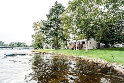 Winthrop House | Lakefront Homey Cottage Offering Pristine Views of Cobosseecontee Lake from the Deck in Winthrop, Maine