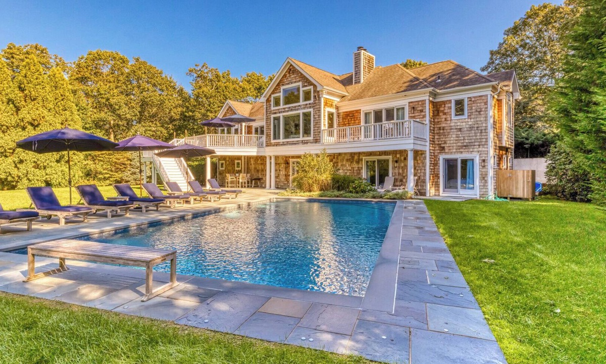 Northwest Harbor House | Modern, coastal-style home with flooding natural light, a private pool, a.
