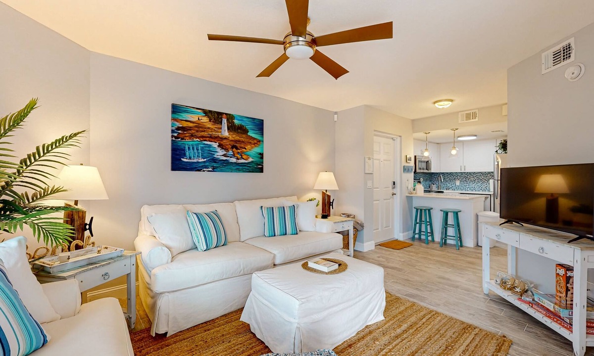 Cape Caneveral Beach Gardens Condo | Pristine condo with shared pool, hot tub, and balcony with partial ocean view