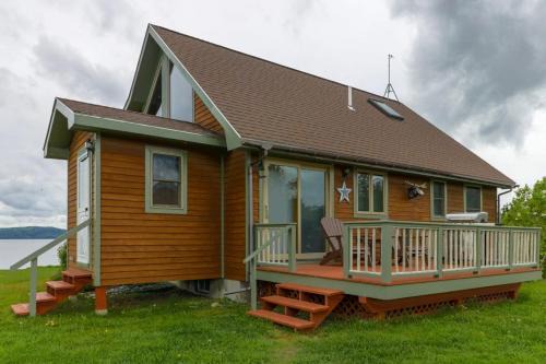 Greenville House | Two lakefront dog-friendly cabins on four acres with porches, dock, & lake views