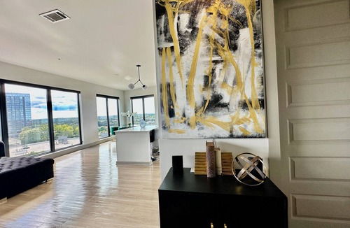 Home Park Apartment | Ceiling to floor windows featuring a private balcony with stunning city views!