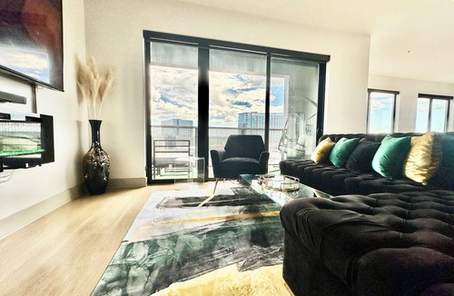 Home Park Apartment | Ceiling to floor windows featuring a private balcony with stunning city views!