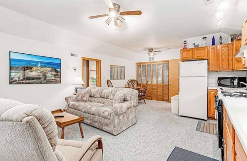 Lakeside House | Charming home with sunroom, large yard, full kitchen, & washer/dryer
