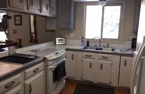 Woodland Park Bed & Breakfast | Furnished Bedroom in our Home with Queen bed - Shared Bath
