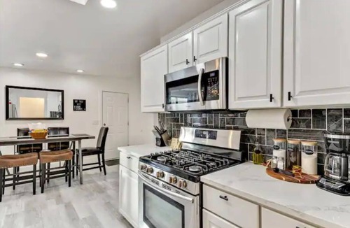 West Valley City House | Heated Pool & Hot Tub open all year with King Beds, Bar & Much More