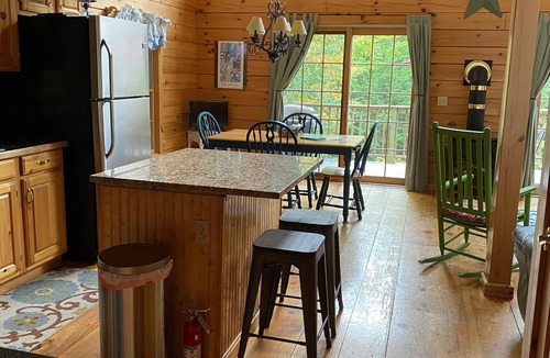 Kents Hill House | Light-Filled Log Home, 4 Wooded Acres, & Lake Access. The water is 0.4 mi away.