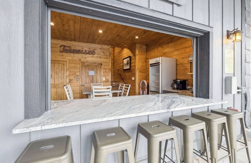 Sevierville Cabin | Luxury Cabin with Views, Pool, Elevator, Outdoor Kitchen and Indoor/Outdoor Bar
