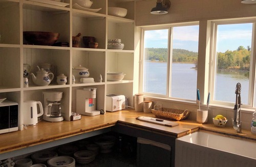 Calais House | Pet Friendly Waterfront home- Kayaks, Game Room, Playset, toddler area & office