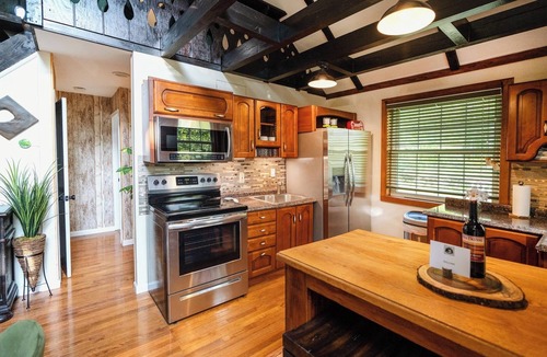 Yulan House | Private log cabin nestled at the base of a secluded wooded area