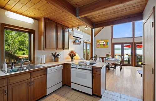Romulus House | Relax at Poplar Beach Retreat on the sparkling waters of Cayuga Lake. This charming waterfront escape combines rustic character with bright, comfortable living spaces, creating the perfect setting for a relaxing Finger Lakes getaway.
