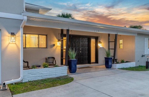 Satellite Beach House | SAND CASTLE: Big beach house. Walk to Beach. Heated Pool in screened pool house.