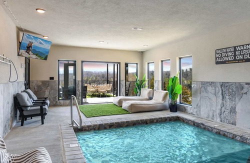 Sevierville Ski Chalet | Sleeps 22 + Indoor Pool + FREE Waterpark Access + Theater + Game Room + Hot Tub