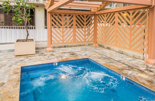 Waikiki Apartment | Studio with hardwood floors, ocean views - pool, hot tub, & sauna on-site
