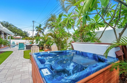Seacoast Shores House | Tropical Retreat: Indian Harbour Beach Home with BBQ Grill, Fire Pit, Private Pool & Hot Tub! 🌴