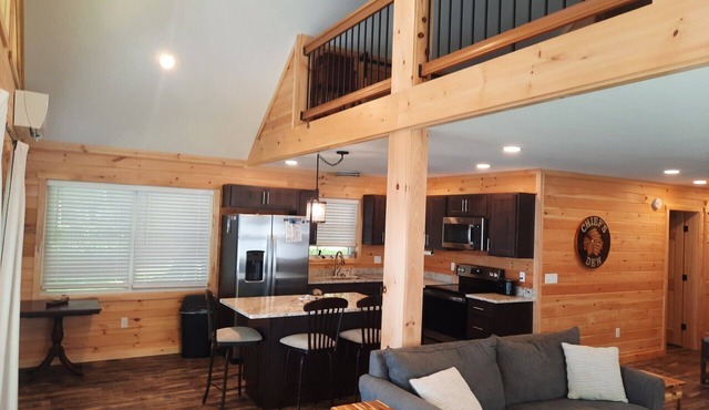 Enjoy amazing sunsets while steps from North Pond in this cozy 3-bedroom camp.
