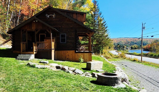 Gorgeous log cabin overlooking the Dead River just north of Berry's Store Rt 201