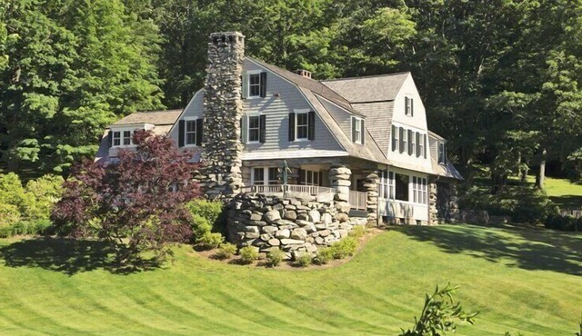 Lakefront Home set on five acres of land, deck, patio, lounge seating by...