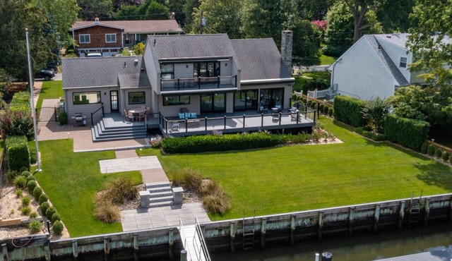 Pristine waterfront home with direct access to private bay and dock,.
