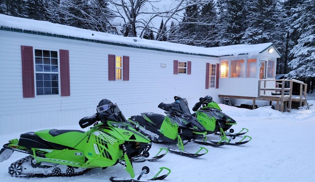Secluded camp off the snowmobile trail
