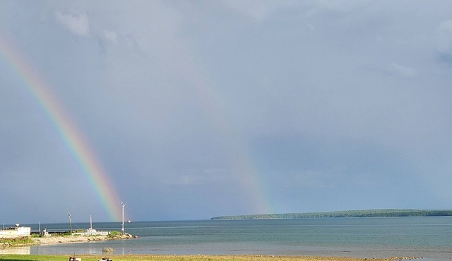 "Sunset Beach" Camper in Fairport on 435' of Lake Michigan shoreline