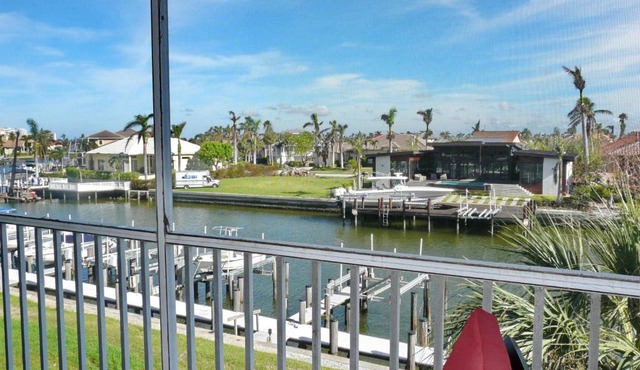 Tranquil waterfront condo with pool and steps to beach