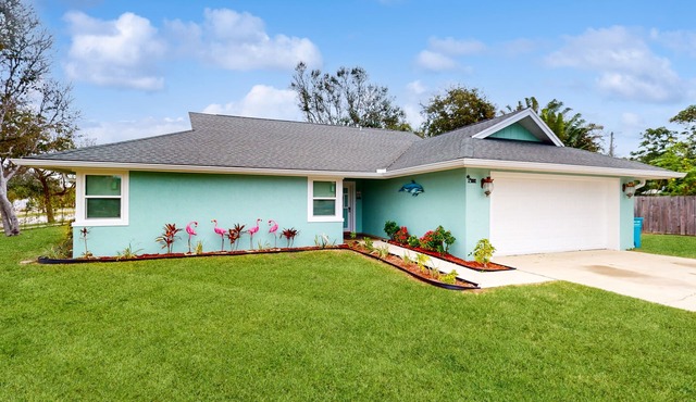 Updated home with beach access, games, grill, & central AC - snowbird-friendly