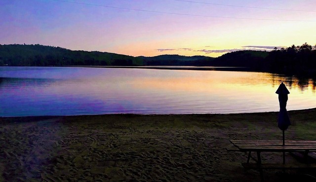 Waterfront lake house with private beach on Paradox Lake