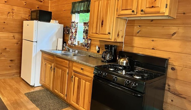Cabin fully equipped, trails on site, centrally located, snowmobiling, rafting