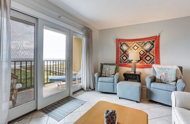 Oceanfront 2BR/2BA condo with pool, balcony, and beach access.